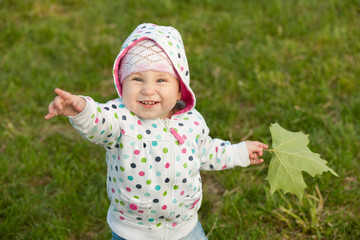 Little girl with a leaf