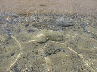 stones in the clear sea