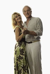 Fototapeta premium senior couple dancing together and smiling