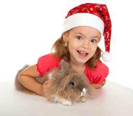 Child in the New Year hat with a rabbit.
