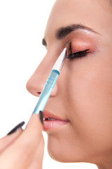 woman applying make-up