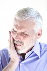 Senior man portrait pucker teeth pain
