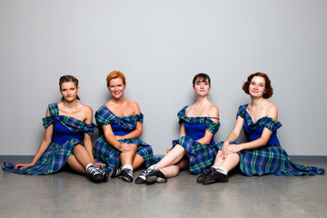 Group of dancers of the Scottish dance in kilts