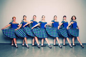 Group of dancers of the Scottish dance in kilts