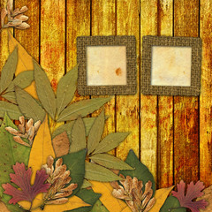 Naklejka na ściany i meble Old grunge frame on the abstract background with autumn leaves