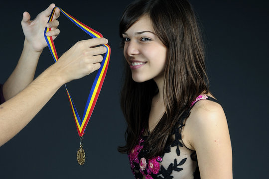Young Sportive Receiving Golden Medal