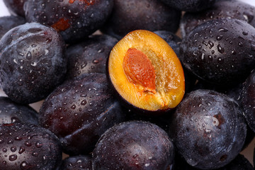 fresh plums with water pearls