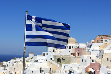 Greece flag on Oia background