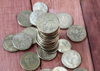 A pile of Australian one dollar coins