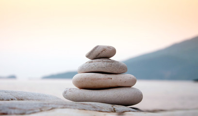 Pebbles balancing on the sea coast