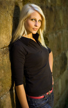 Young blone model posing outdoors