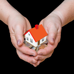 Hands with gift of money and house