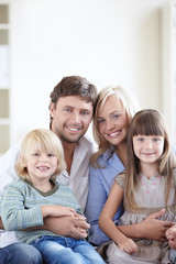 Obraz premium Young family with two children