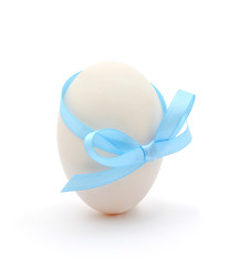 egg with a blue bow