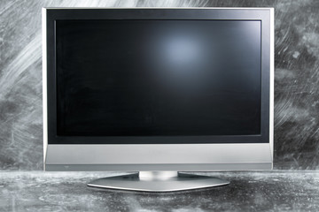 Flat screen television in a metal background