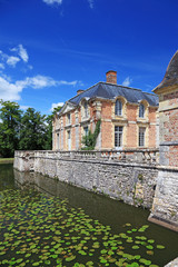 Old french mansion with lake near it, now a museum, France.