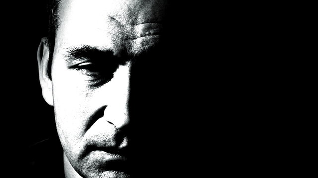 Frightful and unhappy man.Horror film style.