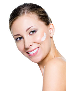 Woman applying cosmetic cream