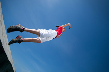 Beautiful woman jump into sky