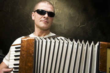 A man plays the accordion