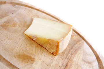 light edam cheese on wood