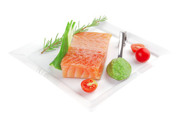 salmon fillet with vegetables and pesto sauce