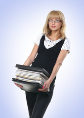 A young business woman holding a pack of documents