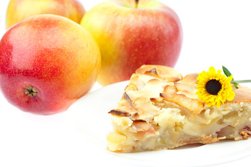 slice of apple pie apple and a flower isolated on white