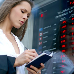 A young businesswoman is checking the curency level