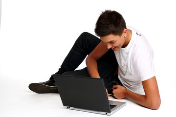 Young man sitting and using a laptop