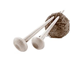 Knitting ball and knitting needles isolated on white.