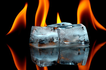 Ice cubes with fire in the background.