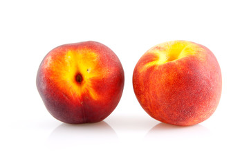 two peaches over white background