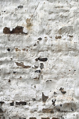 Pealed white paint of ancient Village Wall