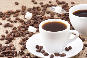 beans and cup on sacking