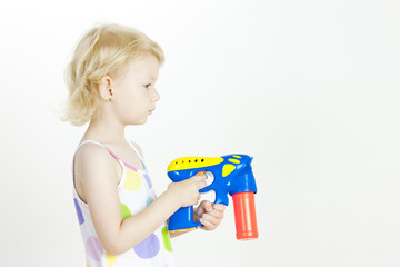 portrait of little girl with bubbles maker