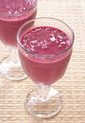 Two glasses of fresh berry smoothies