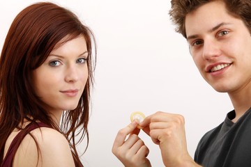 young couple with a condom