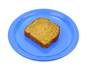 Fototapeta na wymiar Single slice of carrot cake on a blue plate