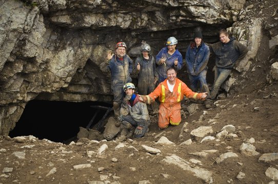Climbers Cheering Outside Cave, Cadomin, Alberta, Canada - Powered by Adobe