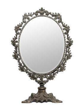 Antique mirror in front of white background