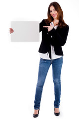 young lady pointing at blank board