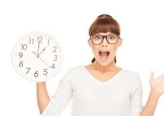 woman holding big clock