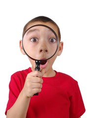 child with magnifying glass, isolated