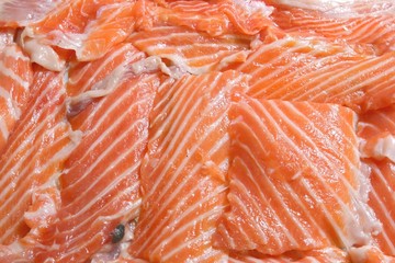 Heap of Fresh sliced salmon Fillet using as background