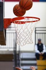 Fototapeta premium Basketballs above hoop