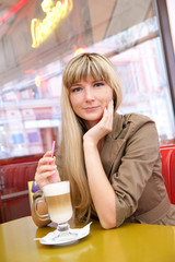 Woman drinking coffee in cafe