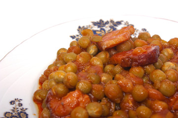 Cooked peas with bacon and carrots