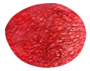 Translucent slice of red grape fruit, macro isolated on white