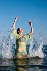 young girl on the sea in summer